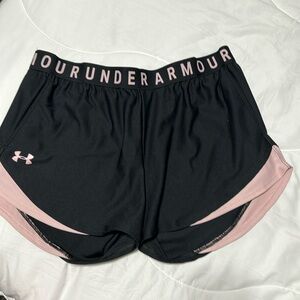 Under Armour shorts for women.  Black with pink rose trim.  Size Large.